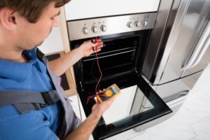 Stittsvile Appliance Repair Technician performing an oven repair